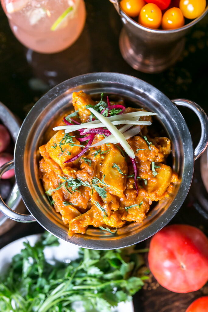 Freshly prepared Gobi Aloo (cauliflower and potato curry) dish.