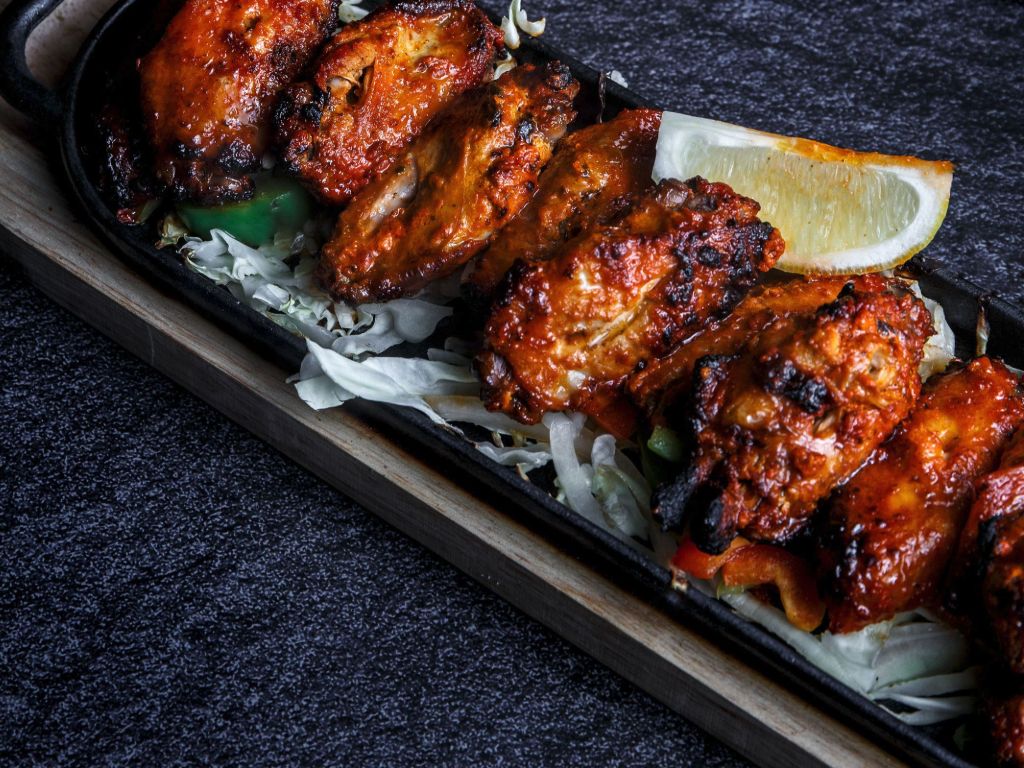 Sula Commercial Drive: Smoky Tandoori Wings Smoky Tandoori chicken wings, perfectly grilled.