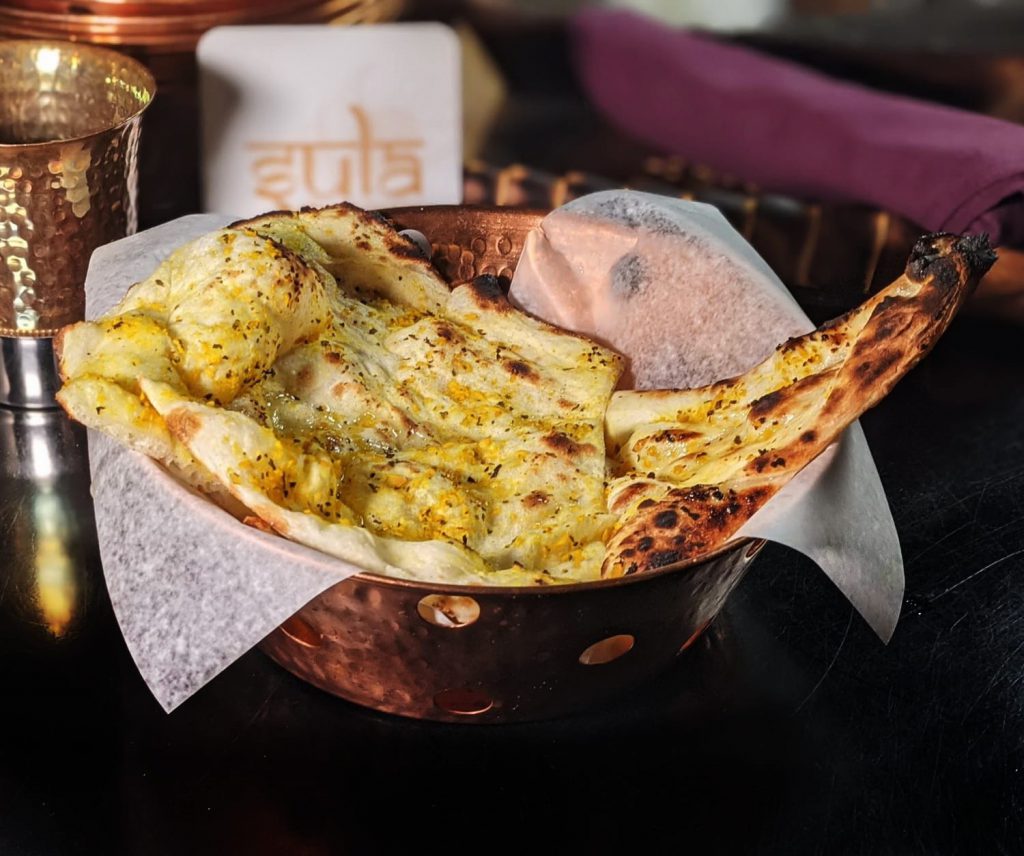 Garlic naan baked in tandoor oven