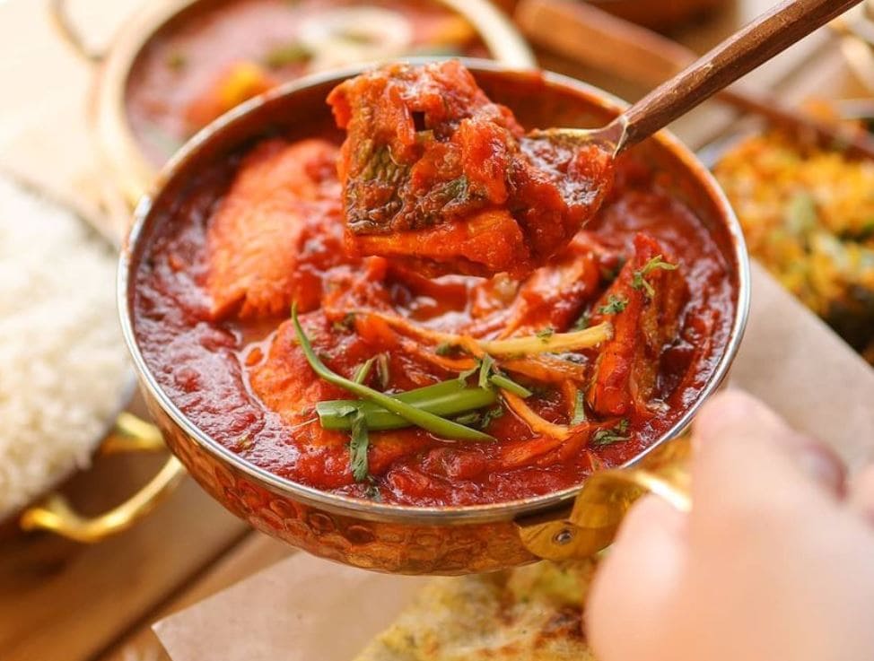 Spicy salmon curry in a rich red tamarind and chili gravy, served with steamed rice